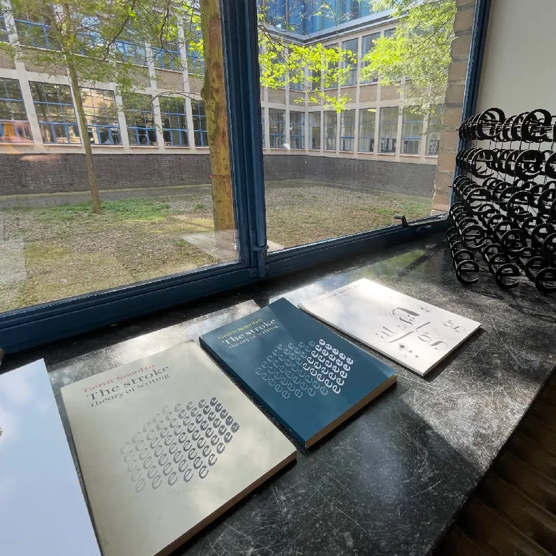 The Hyphen Press and Buitenkant editions next to each other. On the right, a real Noordzij cube.
